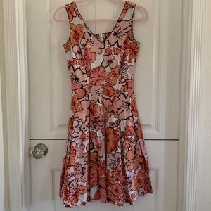 T.S. Size 8, Floral peach and purple midi dress with pockets.